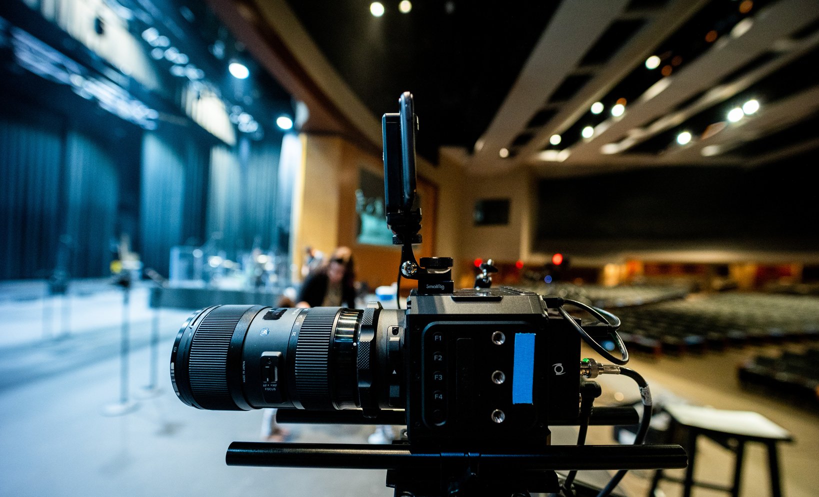 Modern video camera placed near stage